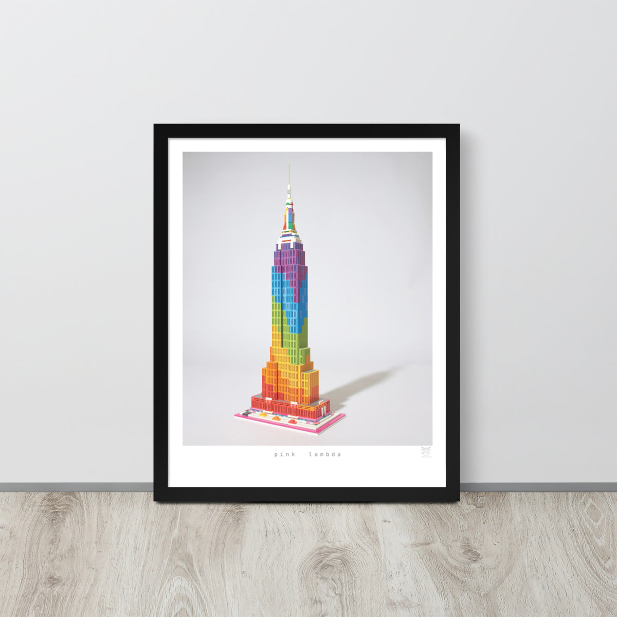 Pink Lambda framed print on a wall