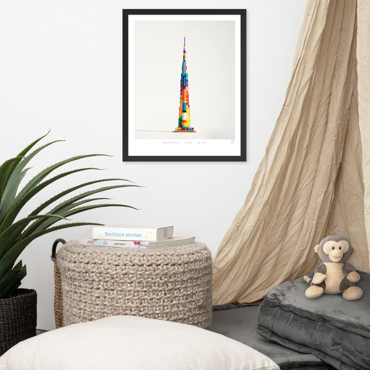 Planeteer Drop Spire framed print on a wall